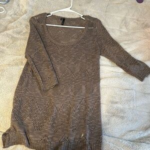 Maurice’s long knitted sweater